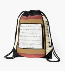 Piano keys with sheet music by Kristie Hubler Drawstring Bag