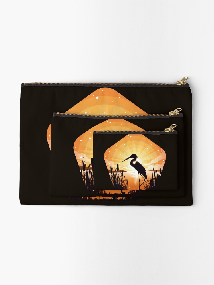 Alternate view of The heron stands on the shore of the lake Zipper Pouch