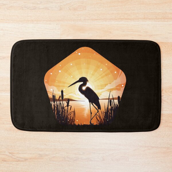 The heron stands on the shore of the lake Bath Mat