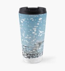 A C-17 Globemaster III on the flight line as fire retardant foam is released. Travel Mug