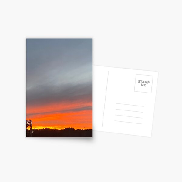George Washington Bridge beneath dark orange and grey sunset Postcard