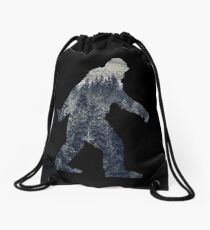 A Sasquatch Silhouette in The North Drawstring Bag