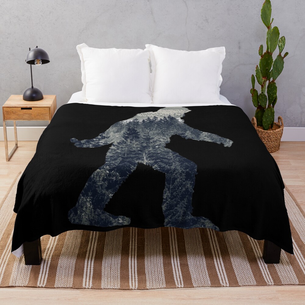 A Sasquatch Silhouette in The North Throw Blanket