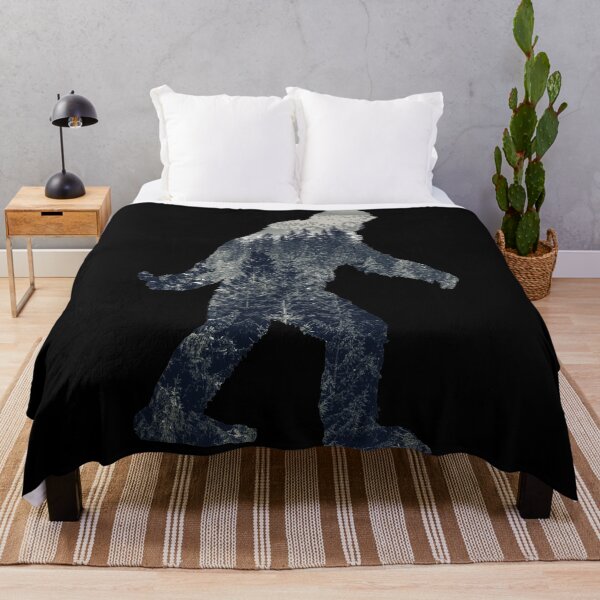 A Sasquatch Silhouette in The North Throw Blanket