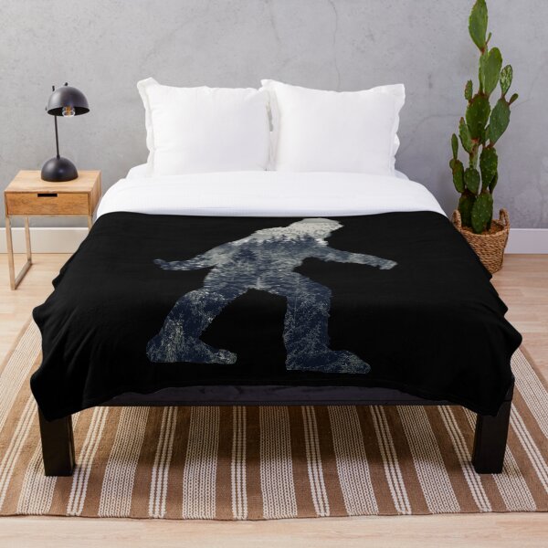 A Sasquatch Silhouette in The North Throw Blanket