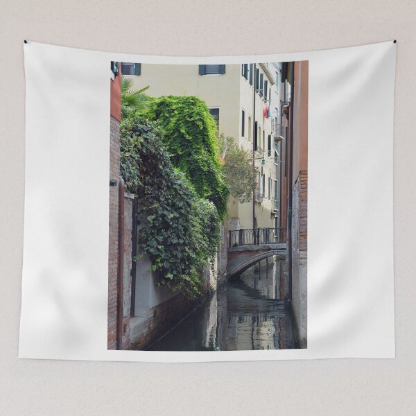 Item preview, Narrow canal in Venice with building covered in green plants designed and sold by oanaunciuleanu.