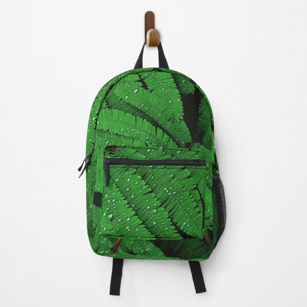 Item preview, Raindrops on Green Leaves Canvas Print designed and sold by Nils Petter Stein.