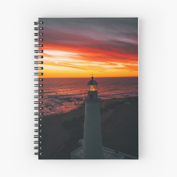 Item preview, Lighthouse On A Sunset Lit Shore designed and sold by Taceo10.