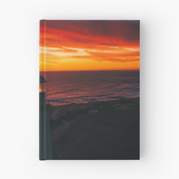 Item preview, Lighthouse On A Sunset Lit Shore designed and sold by Taceo10.