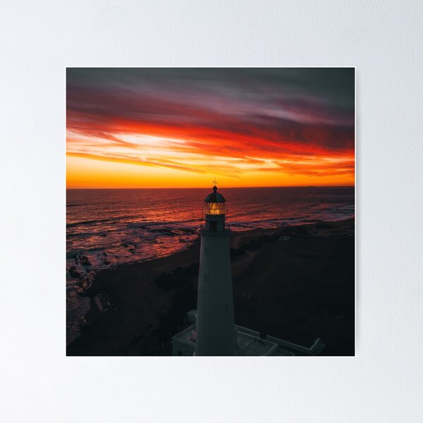 Item preview, Lighthouse On A Sunset Lit Shore designed and sold by Taceo10.
