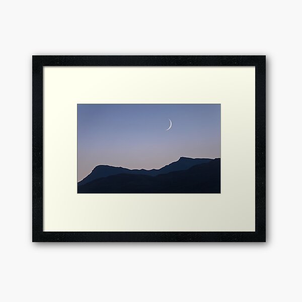 Waxing crescent moon setting over Sgiath Chùil Framed Art Print