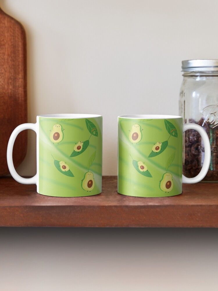 Imagen 2 de 6, Taza de café con la obra Familia de Aguacates, diseñada y vendida por LilyHofmann.