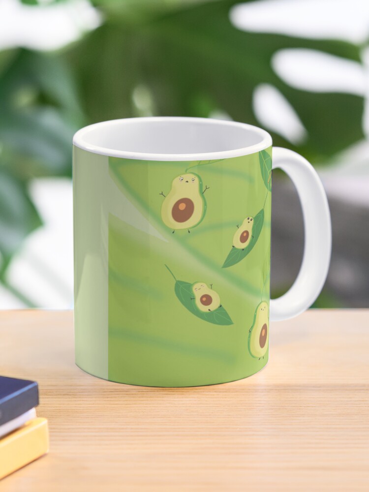 Imagen 1 de 6, Taza de café con la obra Familia de Aguacates, diseñada y vendida por LilyHofmann.