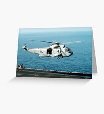 An SH-3H Sea King helicopter prepares to land on USS Saratoga. Greeting Card
