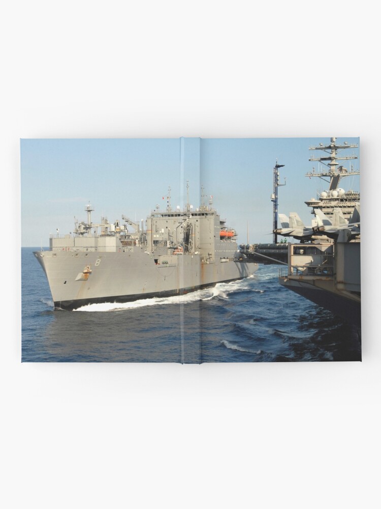 "Dry cargo and ammunition ship USNS Wally Schirra transits alongside