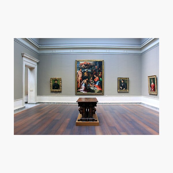 A Room With Four Paintings And A Table Photographic Print
