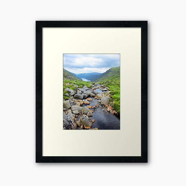 The upper lake, Glendalough viewed from above the waterfall Framed Art Print