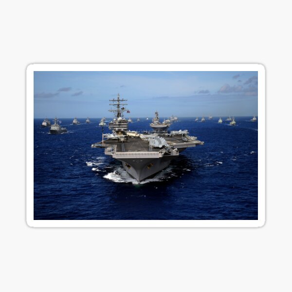 Aircraft carrier USS Ronald Reagan leads a mass formation of ships through the Pacific Ocean. Sticker