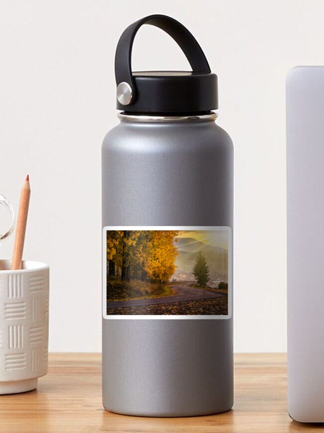Thumbnail 1 of 3, Sticker, mountain road to village in mountains at sunset designed and sold by mike-pellinni.