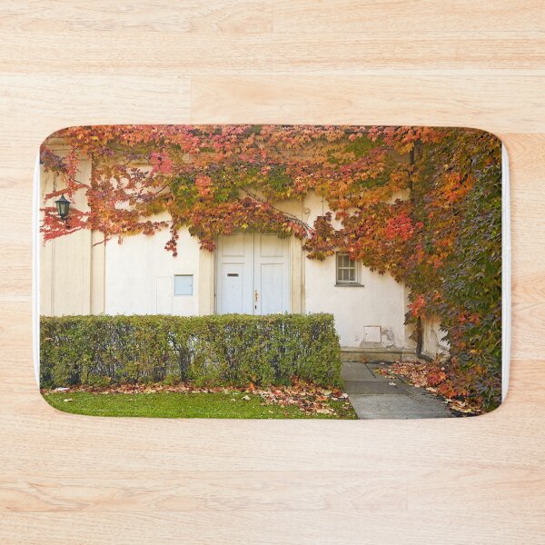 Item preview, the wall of an old house covered with colorful creeper leafs autumn season designed and sold by goceris.