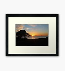 Sunrise reflections over the water Framed Print