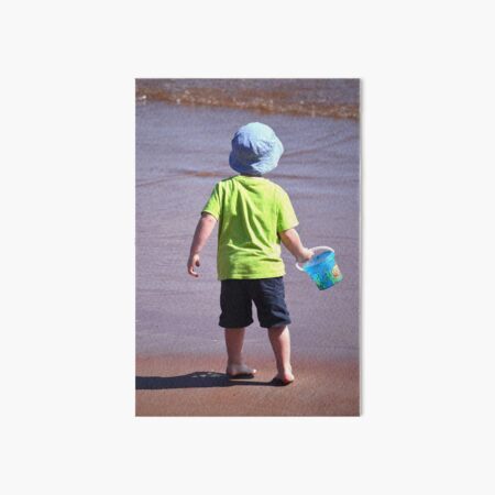 Beach Boy in Blue Hat Art Board Print