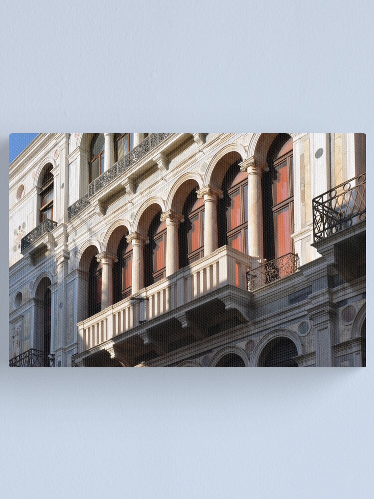 Classical Italian marble building facade with columns arches and balcony Canvas Print