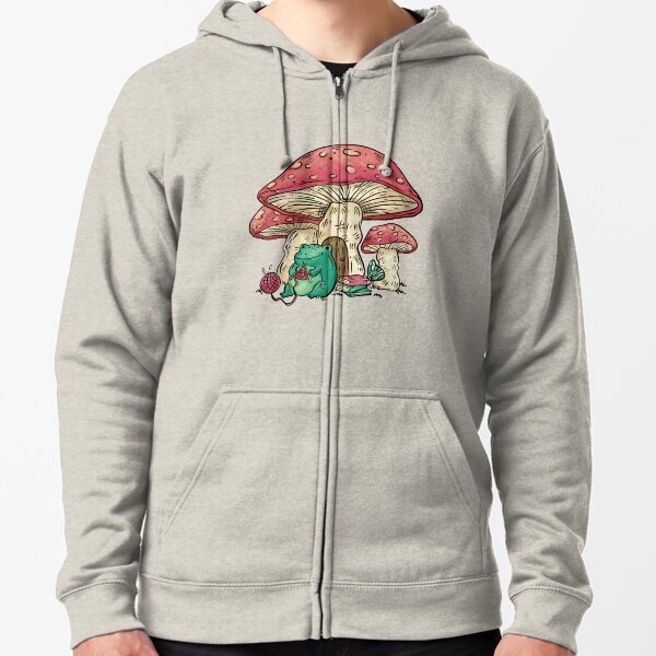 Frog sitting under a mushroom knitting, Cottage Core frog and mushroom, Cute frog and mushroom, Gift for people who knit Zipped Hoodie