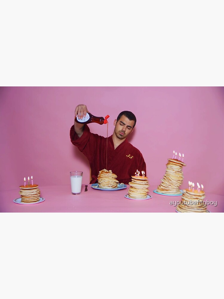 Discover Joe Jonas pouring syrup over some pancakes Premium Matte Vertical Poster