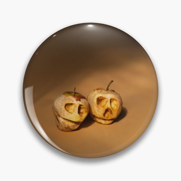 Item preview, Halloween shrunken apple heads on orange background, deep shadows designed and sold by PavlovA982.