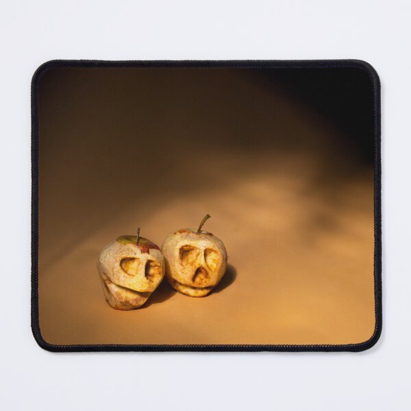 Item preview, Halloween shrunken apple heads on orange background, deep shadows designed and sold by PavlovA982.
