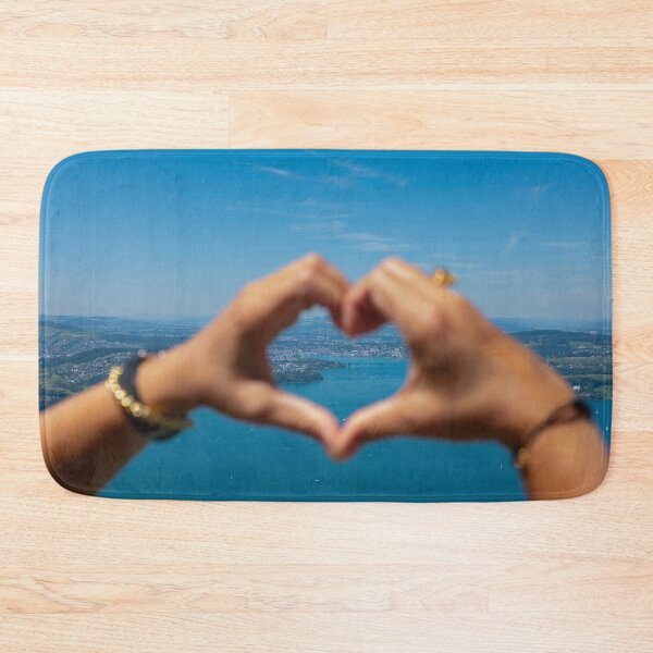 Item preview, Woman Making a Heart Shape with Her Hands with View over City and Lake Lucerne designed and sold by Mats Silvan.