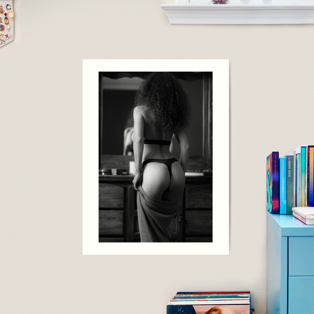 Woman in underwear stretching in bedroom, (B&W) For sale as Framed