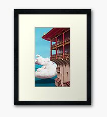 in the clouds Framed Print