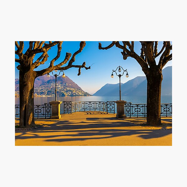Waterfront in Lugano with Bare Tree and Mountain and Lake Lugano Photographic Print