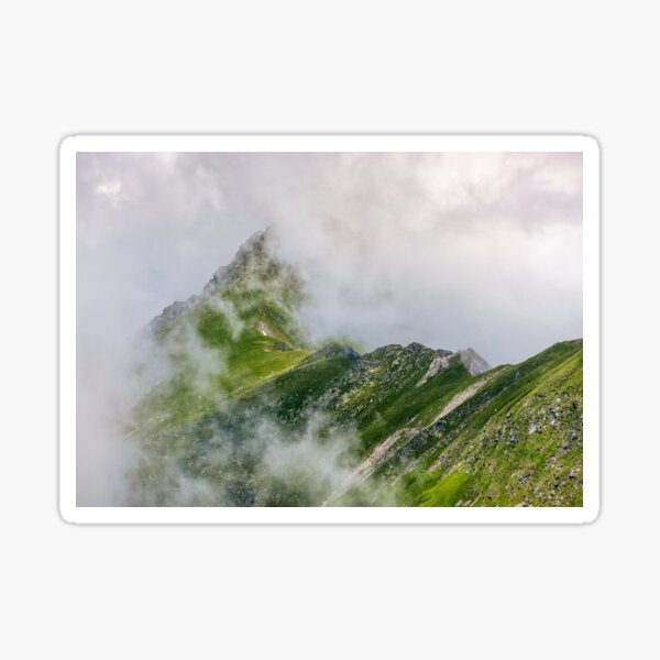Steep slope on rocky hillside in fog Sticker