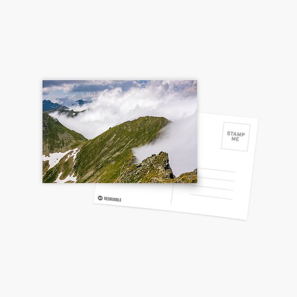 Steep slope on rocky hillside in fog Postcard