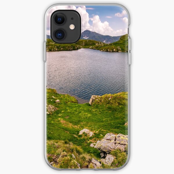 lake in mountains with grass on hillside iPhone Soft Case