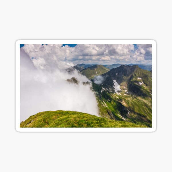 Steep slope on rocky hillside in fog Sticker