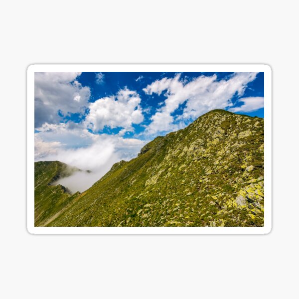 Steep slope on rocky hillside in fog Sticker