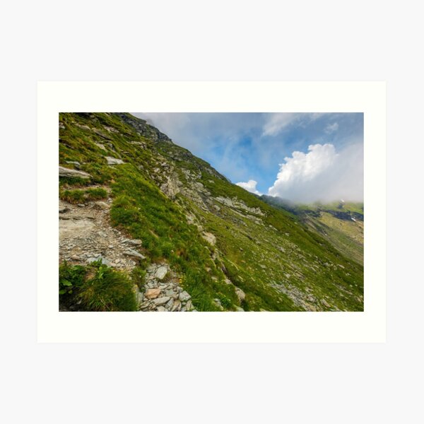 Steep slope on rocky hillside in clouds Art Print
