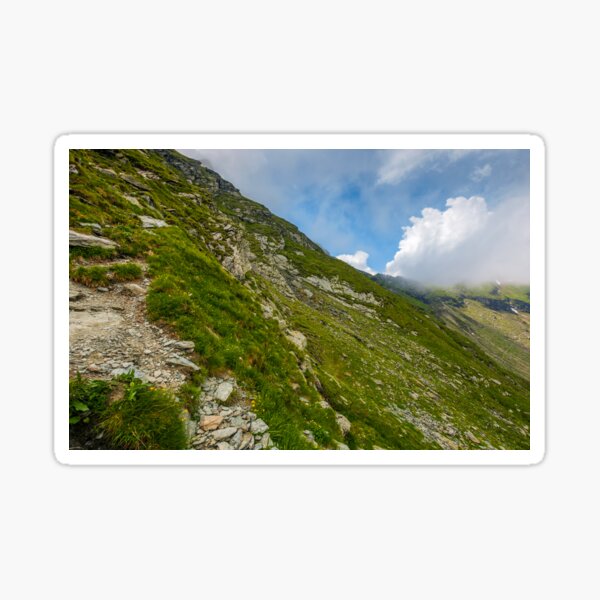 Steep slope on rocky hillside in clouds Sticker