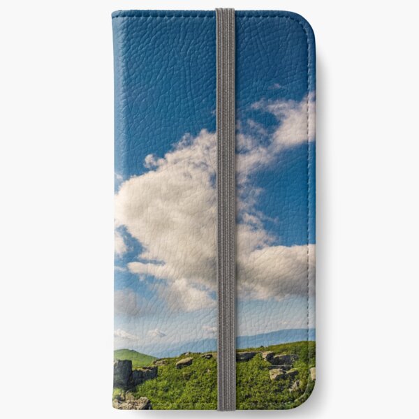 sunburst on a blue sky with clouds over the mountains iPhone Wallet