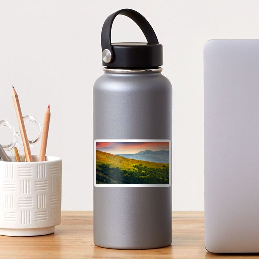 mountain ridge with peak behind the hillside at sunset Sticker