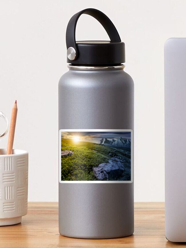 Thumbnail 1 of 3, Sticker, time change concept. meadow with huge stones on top of mountain range designed and sold by mike-pellinni.
