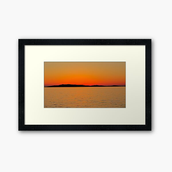 Orange glow after sunset over the sea Framed Art Print