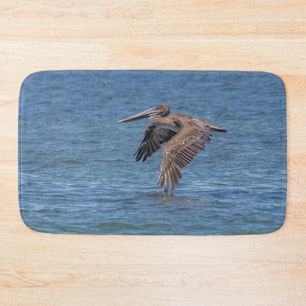 Item preview, Flying Brown Pelican Touches Water with Wing designed and sold by SafariByMarisa.