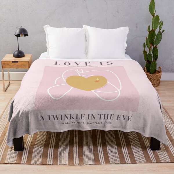 Love is a twinkle in the eye. Sprinkling smiles all over the world. Caroline Laursen original Throw Blanket