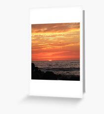sunsetting on the ocean Greeting Card