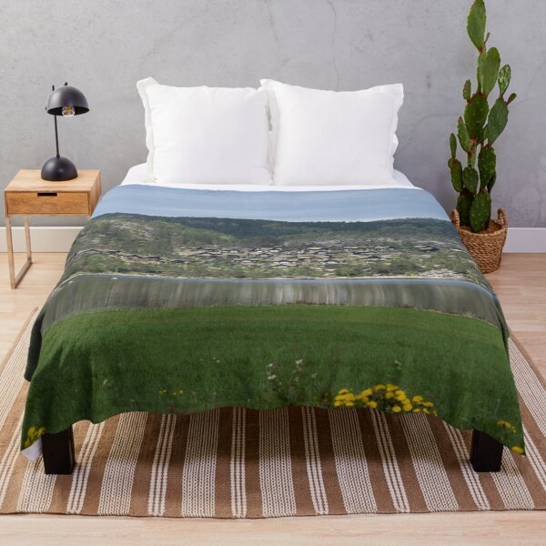 Item preview, Wonderful landscapes in Norway. Vestland. Beautiful scenery of wooden cabins with grass on the roof, reflecting in the lake in a sunny summer day. Yellow flowers in foreground designed and sold by Maurizio Fabbroni.